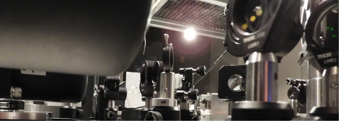 Optics on a table with a bright light in the background